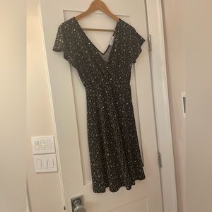 Kayleigh black floral mock wrap dress with v neck and v back. Size S. EUC
